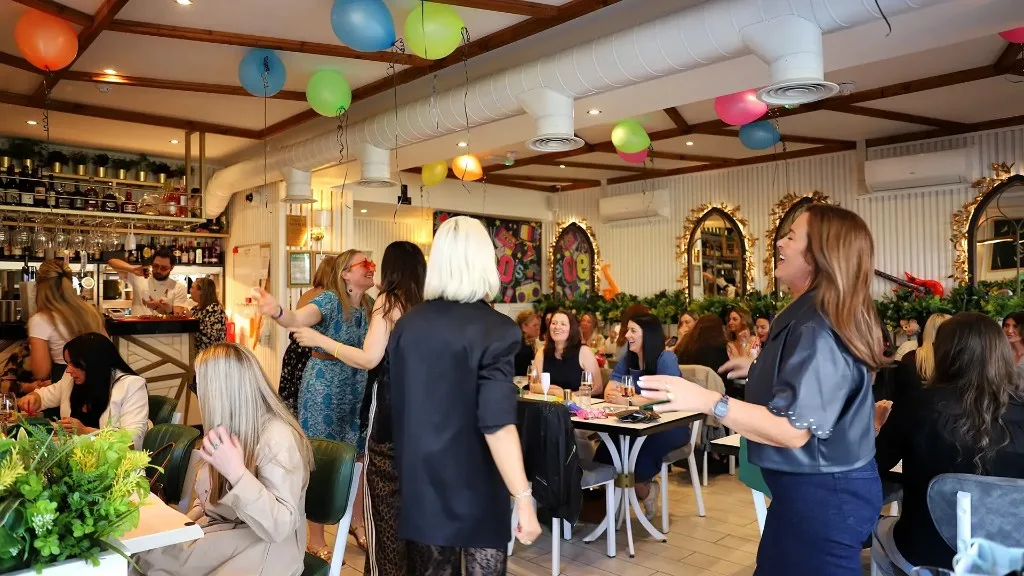 Guests dancing in the dining room on an event night